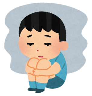 膝を抱える子ども