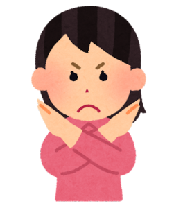 「ダメ」のポーズをする人