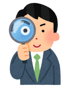 虫眼鏡を持つ男性