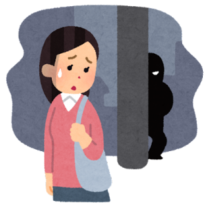 女性にこっそりとつきまとっている（尾行している）悪い顔をしたストーカー